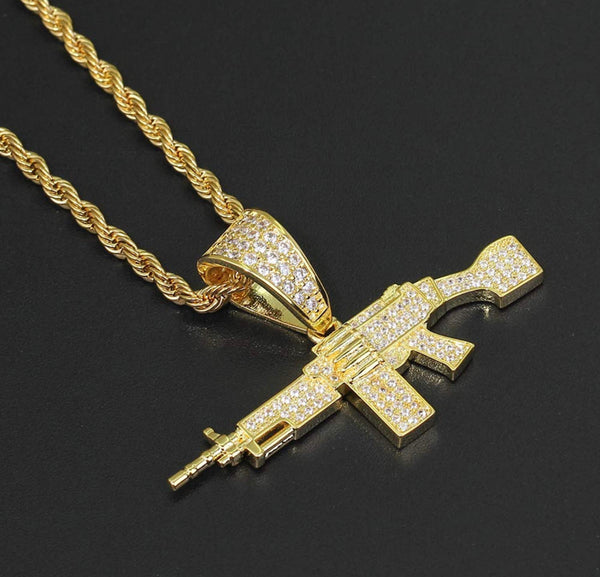 Iced Out 18k Gold Machine Gun Pendant