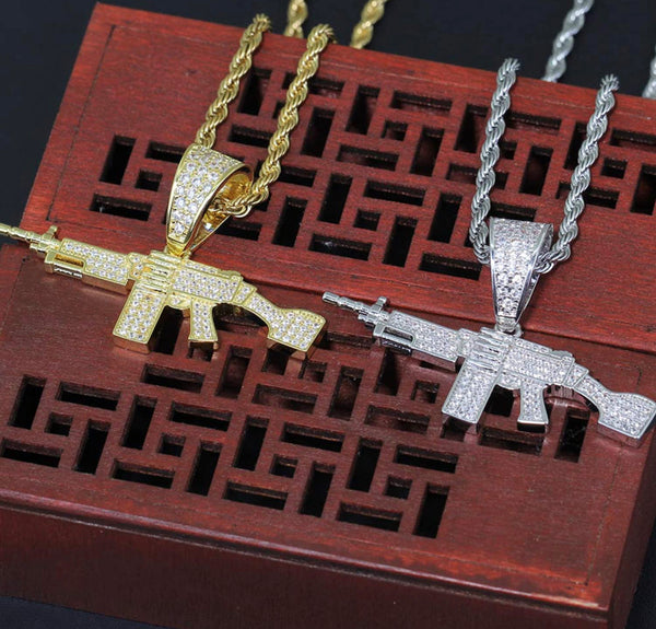 Iced Out 18k Gold Machine Gun Pendant